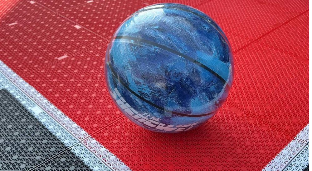 Basketball on court tile surface