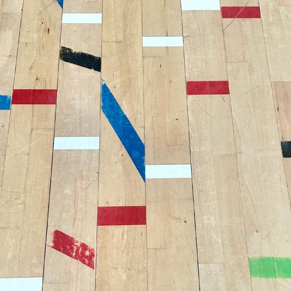 Reclaimed Beech with original taped court markings